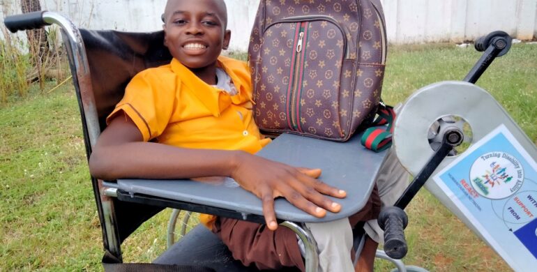 ERIC RECEIVES A TRICYCLE AND EDUCATIONAL MATERIALS